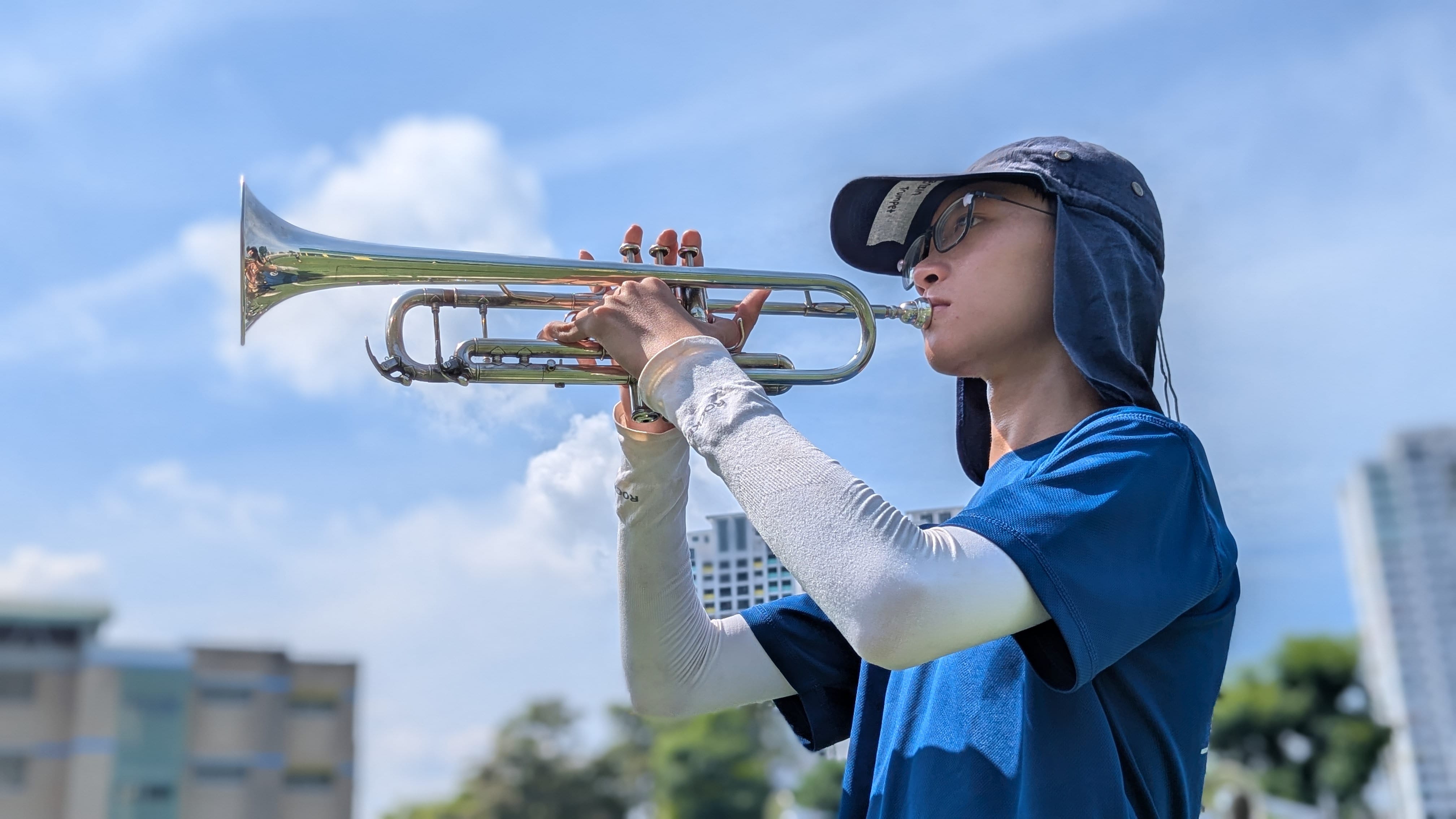 Girl playing trumpet.